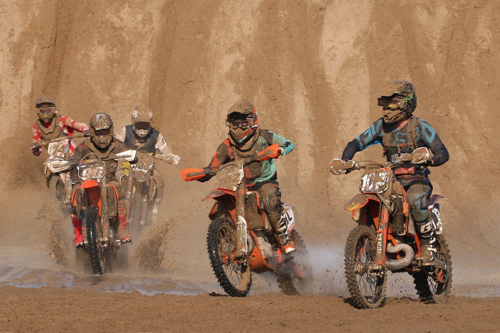 Motocross riders in a sandy beach motorbike race